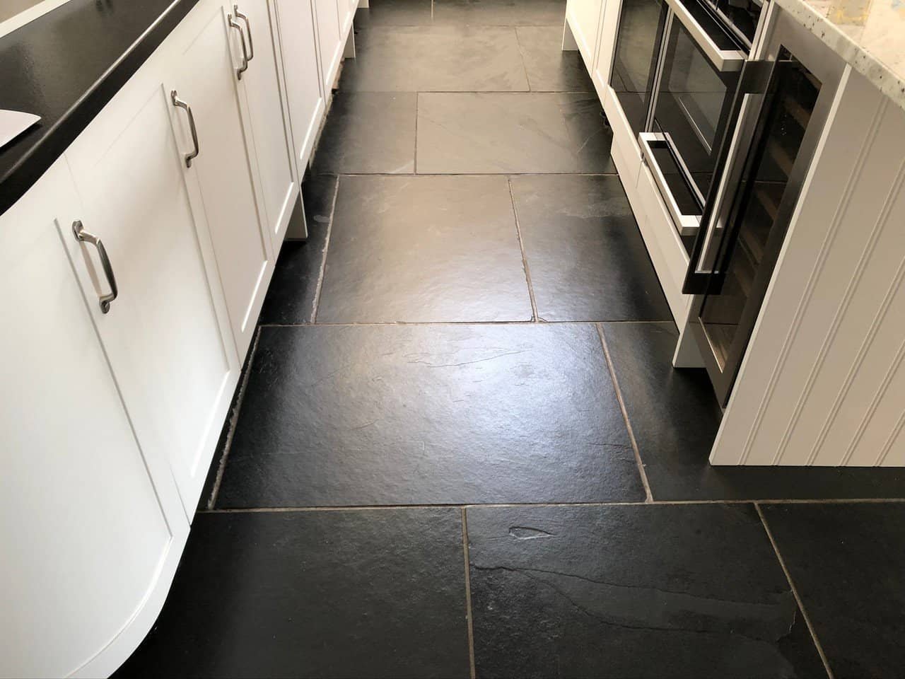 Cleaned slate floor showing revived colour variation before sealing